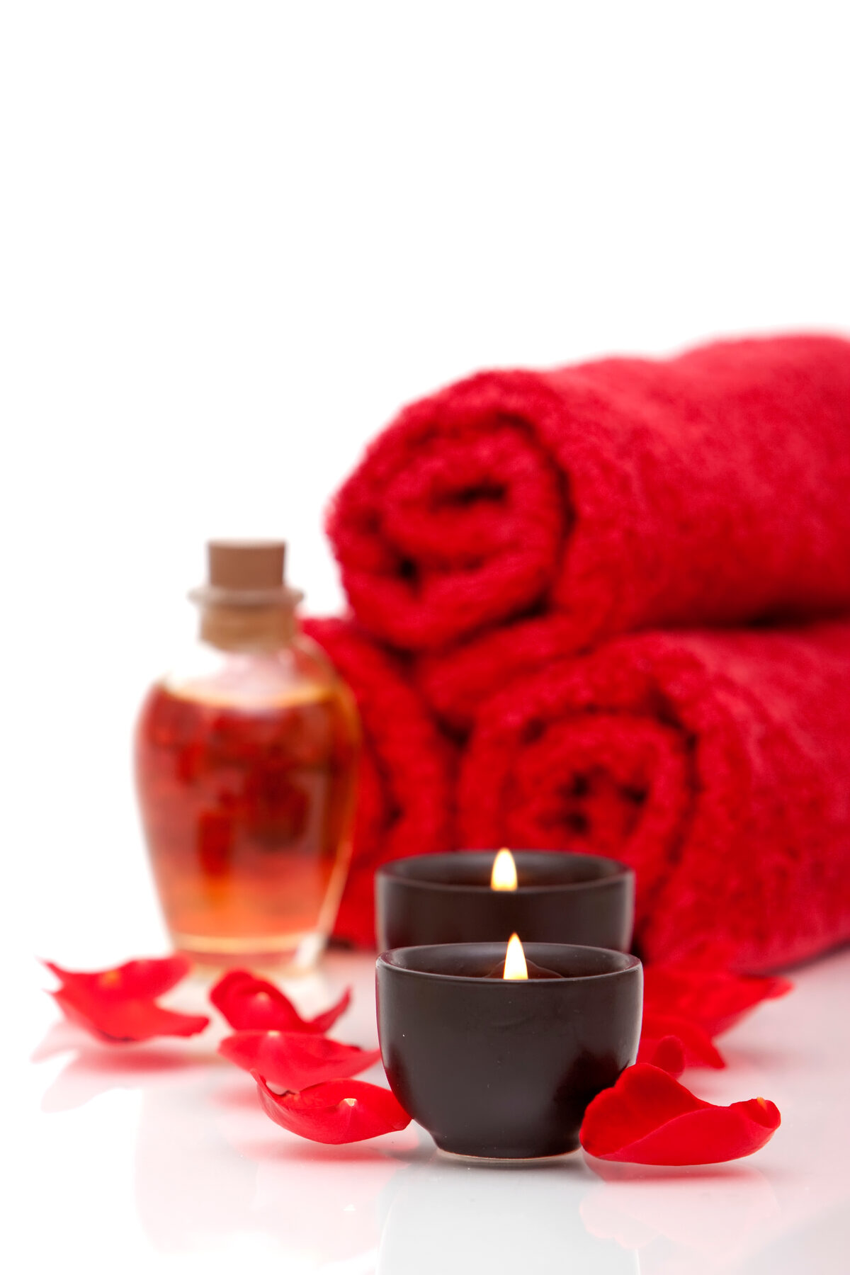 Candles and rose petals arranged for a healing session