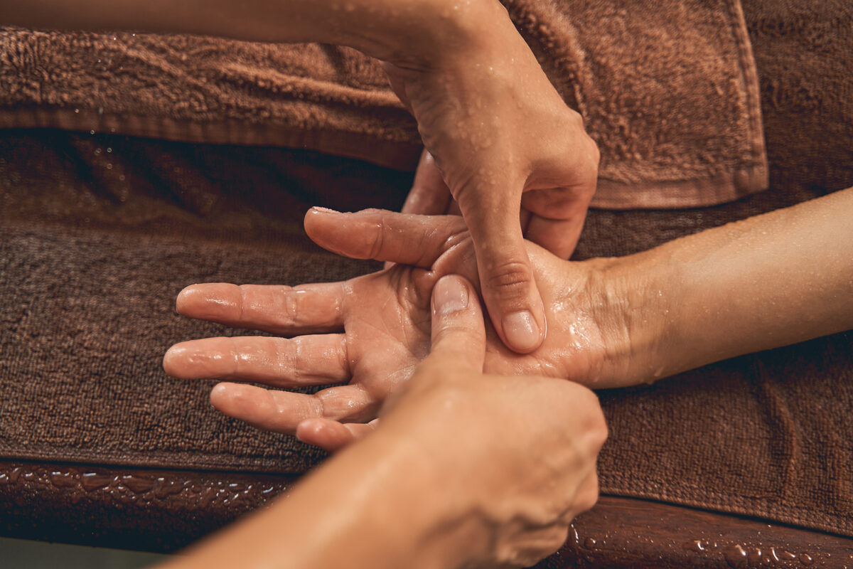 Woman receiving therapeutic bodywork in a wellness setting
